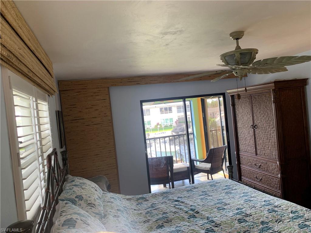 Bedroom featuring access to outside and ceiling fan