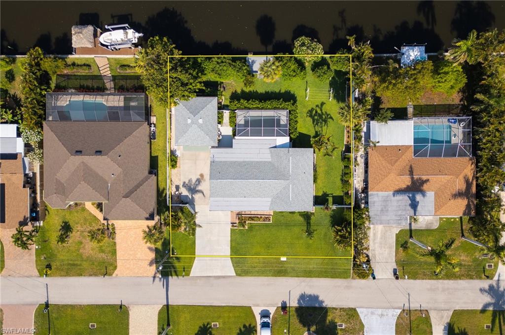 Aerial view of residential area with property parcel outlined