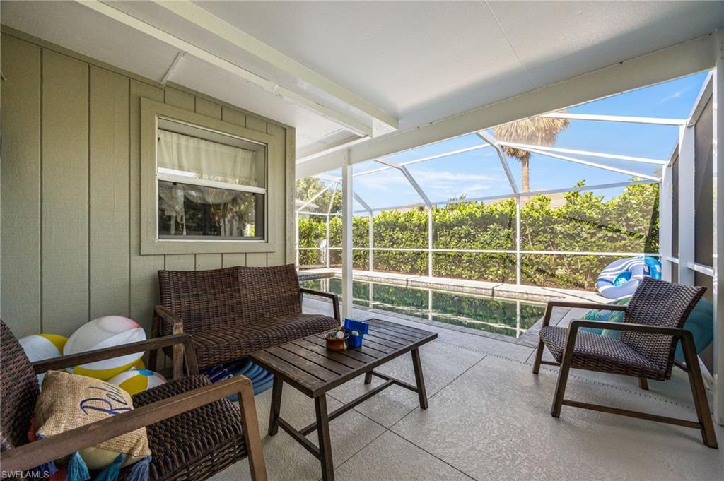 Sunroom / solarium with a patio area and an outdoor hangout area