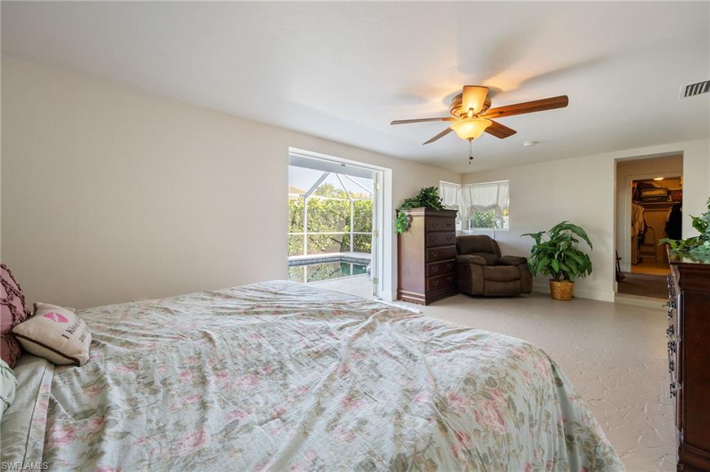Bedroom with access to outside and ceiling fan