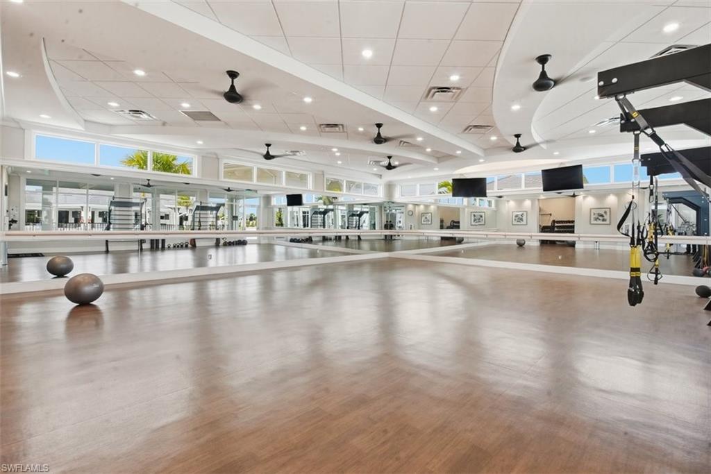Workout area featuring ceiling fan and recessed lighting