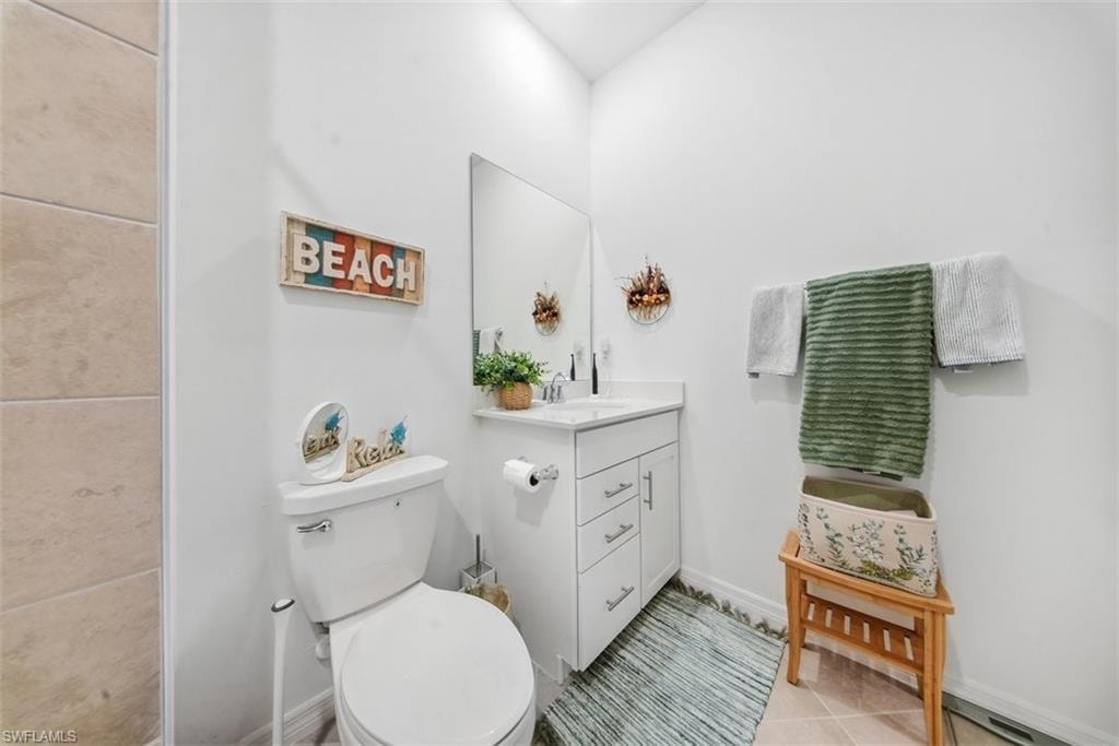 Bathroom with vanity and light tile patterned floors