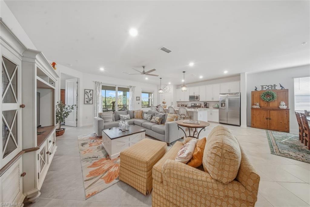 Living room featuring recessed lighting and ceiling fan