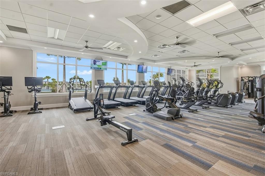 Exercise room featuring a paneled ceiling and a ceiling fan