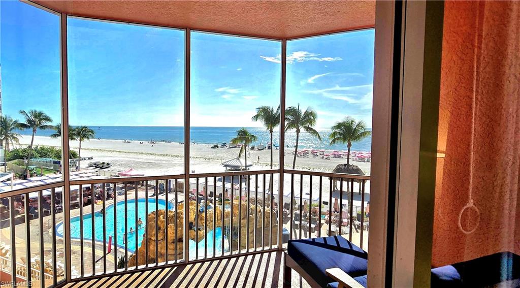 Screened balcony featuring view of Gulf and beach