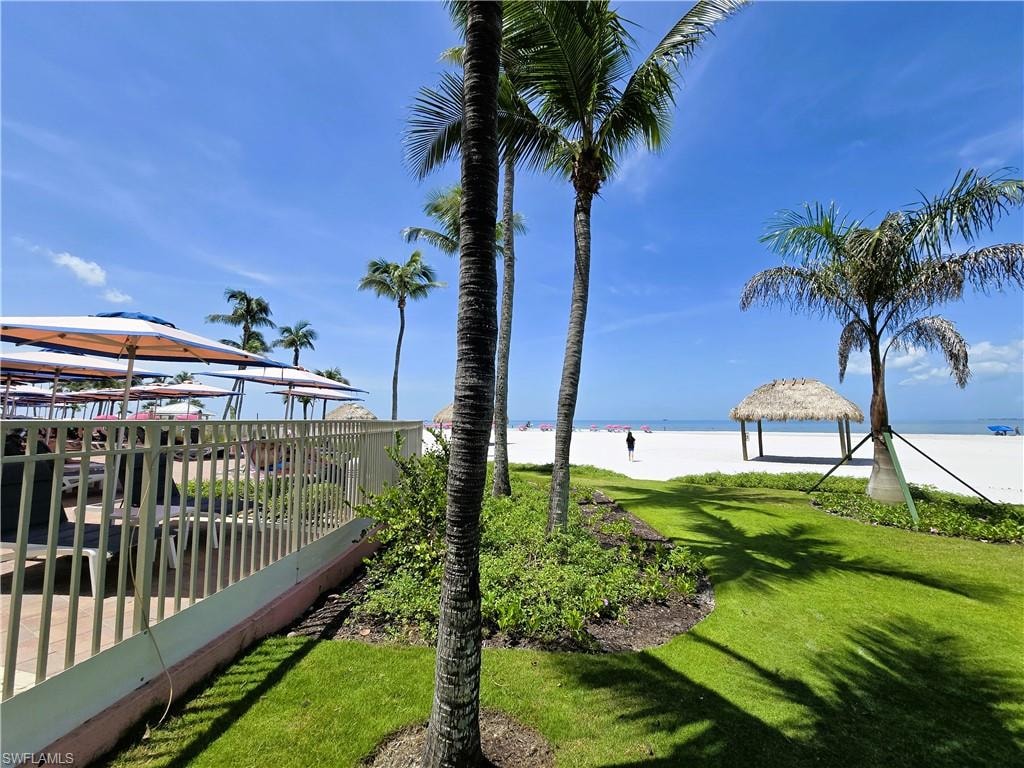 View of green lawn with a water view