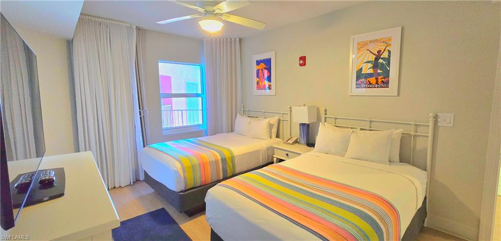 Bedroom featuring wood finished floors and a ceiling fan