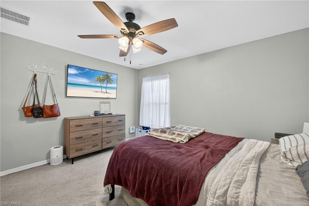 Bedroom featuring carpet floors and a ceiling fan