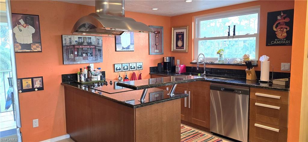 Bar with stainless steel dishwasher, dark stone counters, cooktop, island range hood, and sink