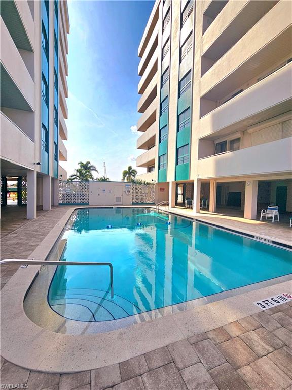 Community pool featuring a patio