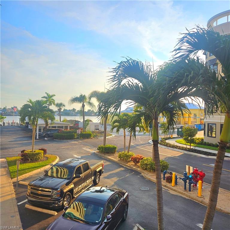 Uncovered parking lot with a water view