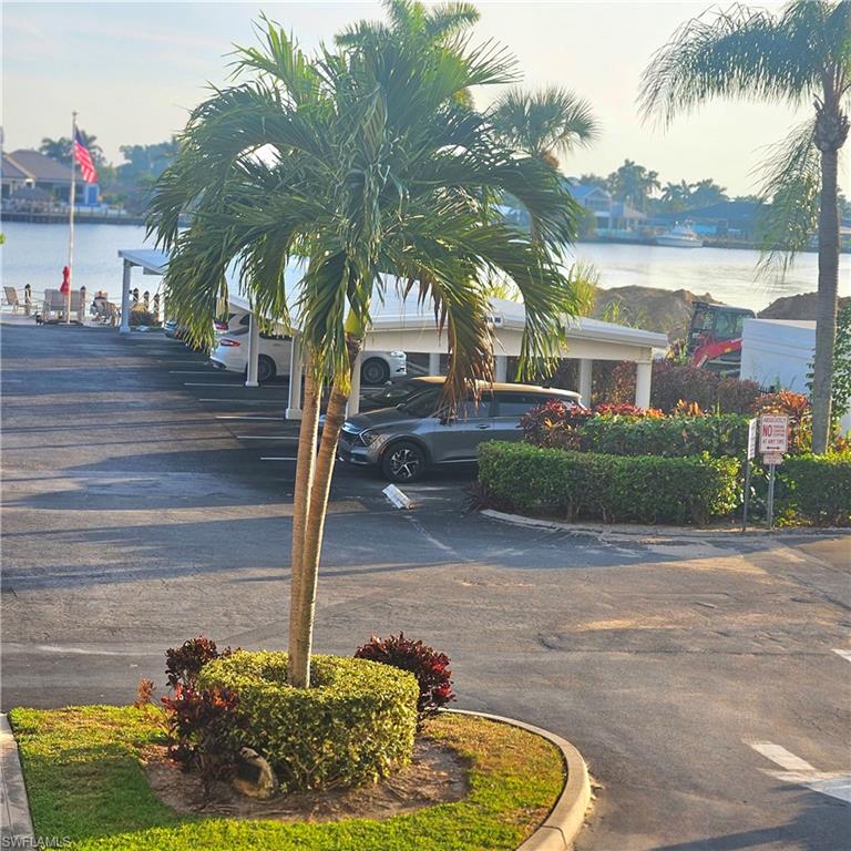 View of asphalt road featuring a water view