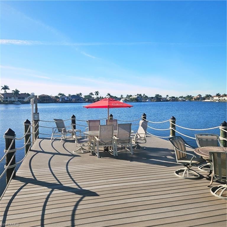 Dock area with a deck with water view