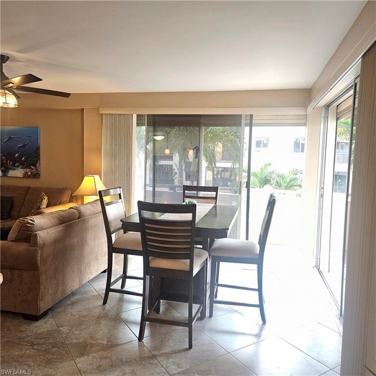 Dining area featuring light tile patterned floors