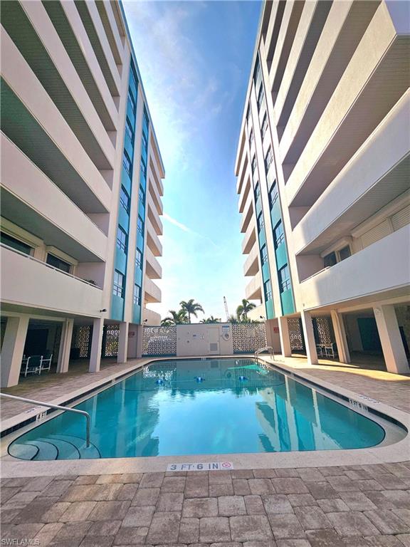 Community pool with a patio area