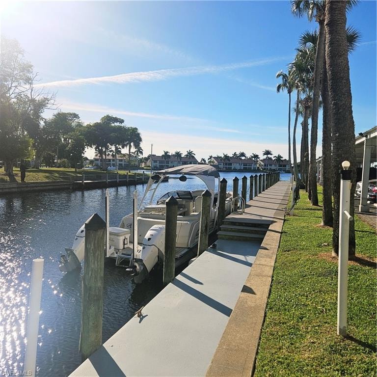 Dock area featuring a water view