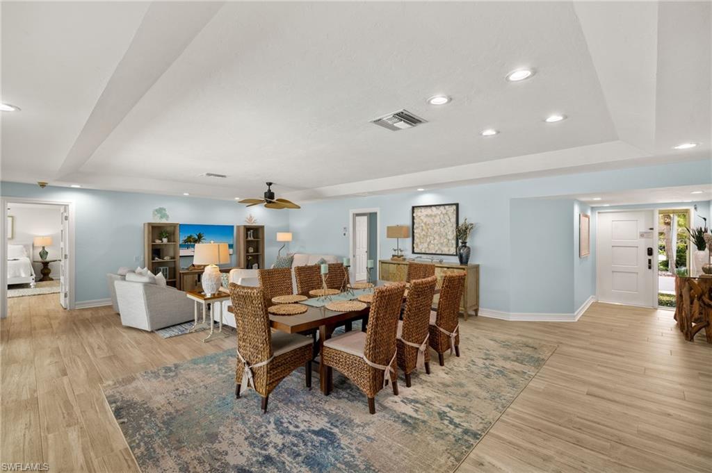 Dining space with recessed lighting, light wood finished floors, and a ceiling fan