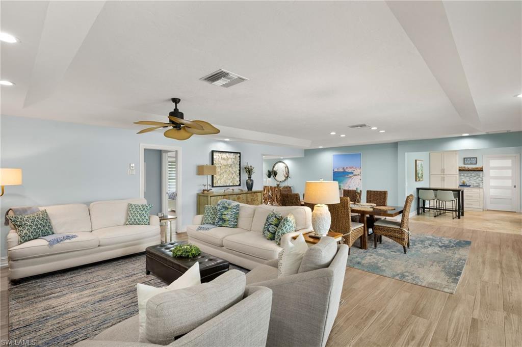 Living area featuring recessed lighting, wood finished floors, and a ceiling fan