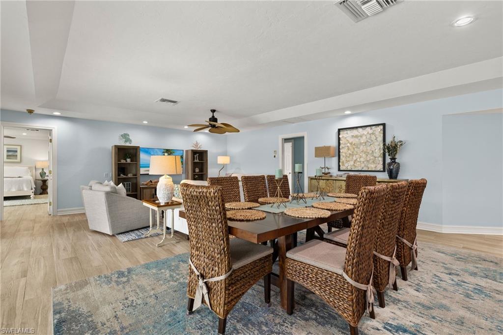 Dining room with recessed lighting, light wood-type flooring, and ceiling fan