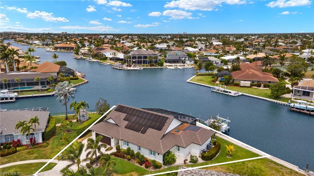 Aerial view of residential area with a large body of water