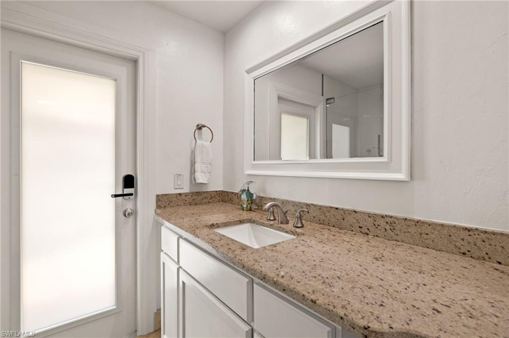 Full bathroom featuring vanity and a shower