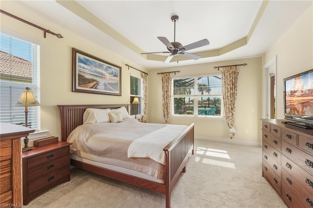 View of Pool/Lake, New Carpet 2022, Tray Ceiling, Door to Lanai.