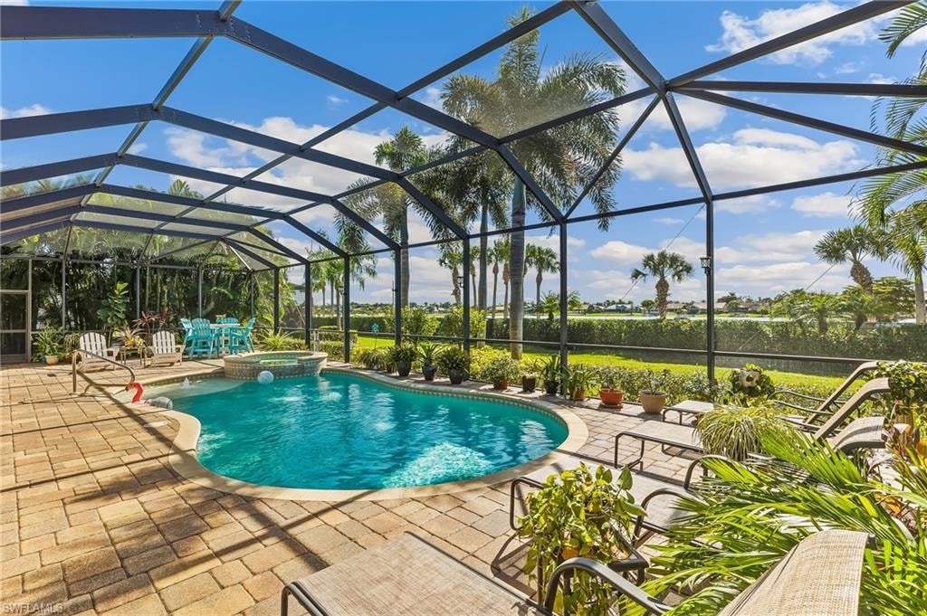 Areca palms on both sides of lanai for privacy. Lanai spans width of house.