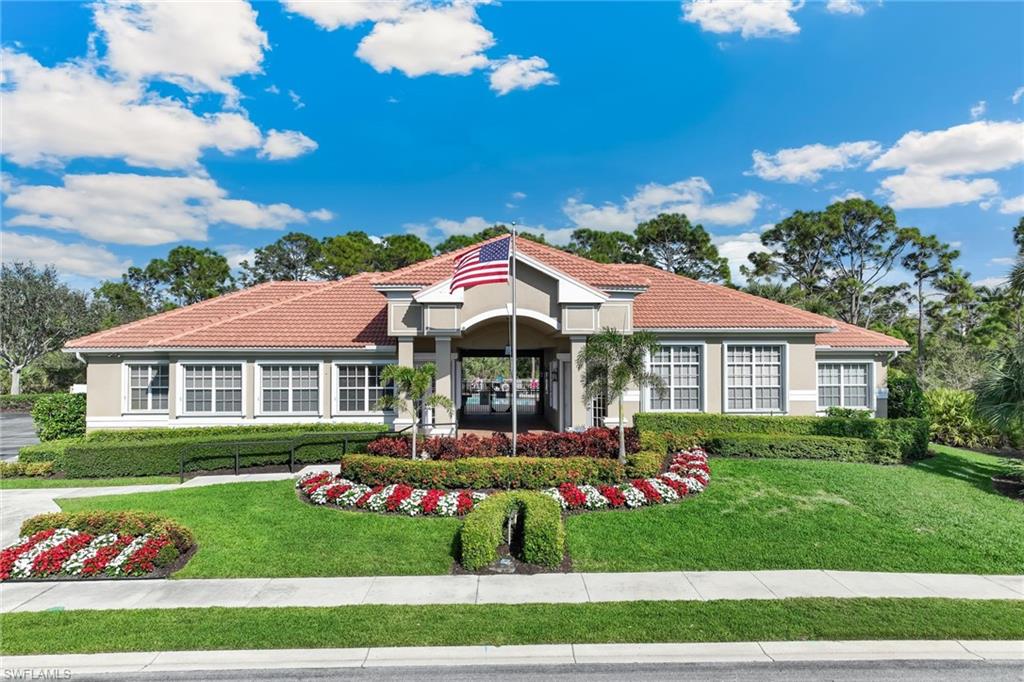 Clubhouse with exquisite & colorful landscaping.