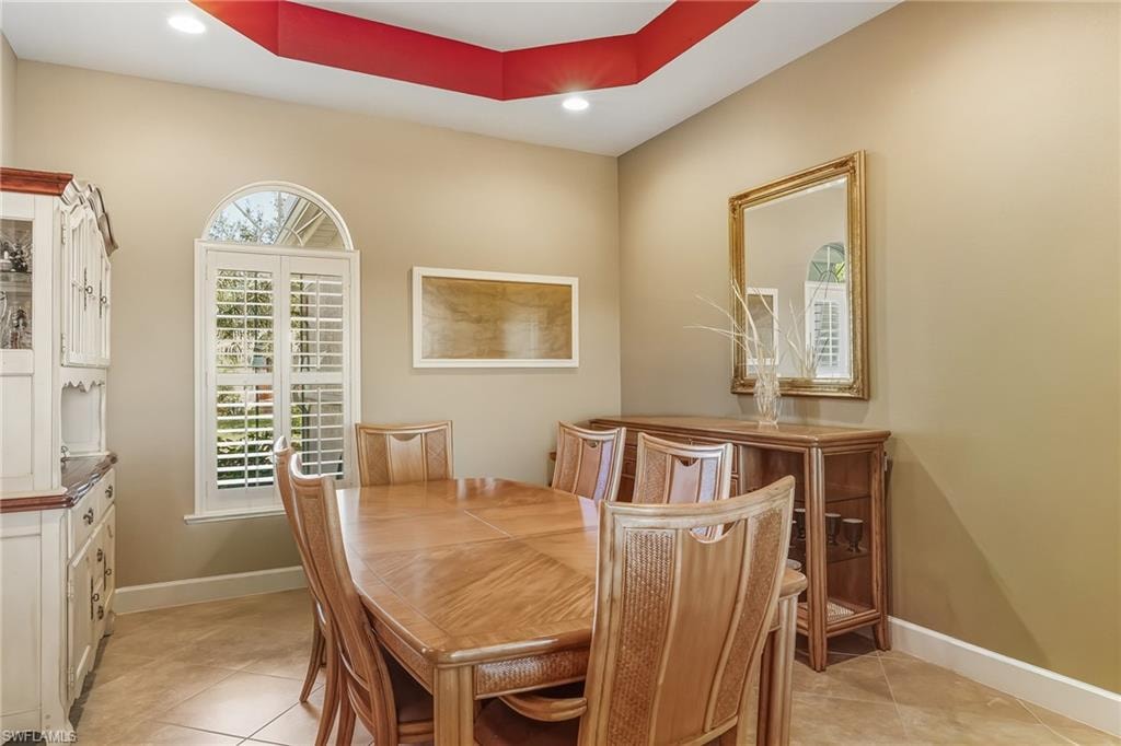 Formal Dining Room with tray ceiling, arched entrys.