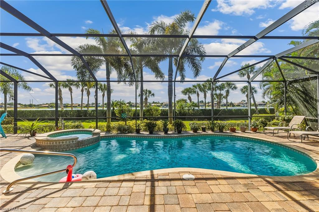 Lovely view from almost every room of the home. Privacy wall hidden by hedge & maintained by HOA.
