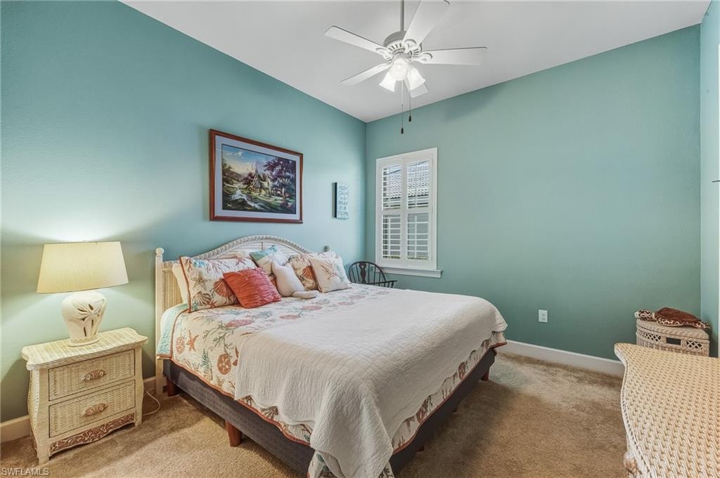 Middle bedroom with carpet, ceiling fan and jack n jill bath with den.