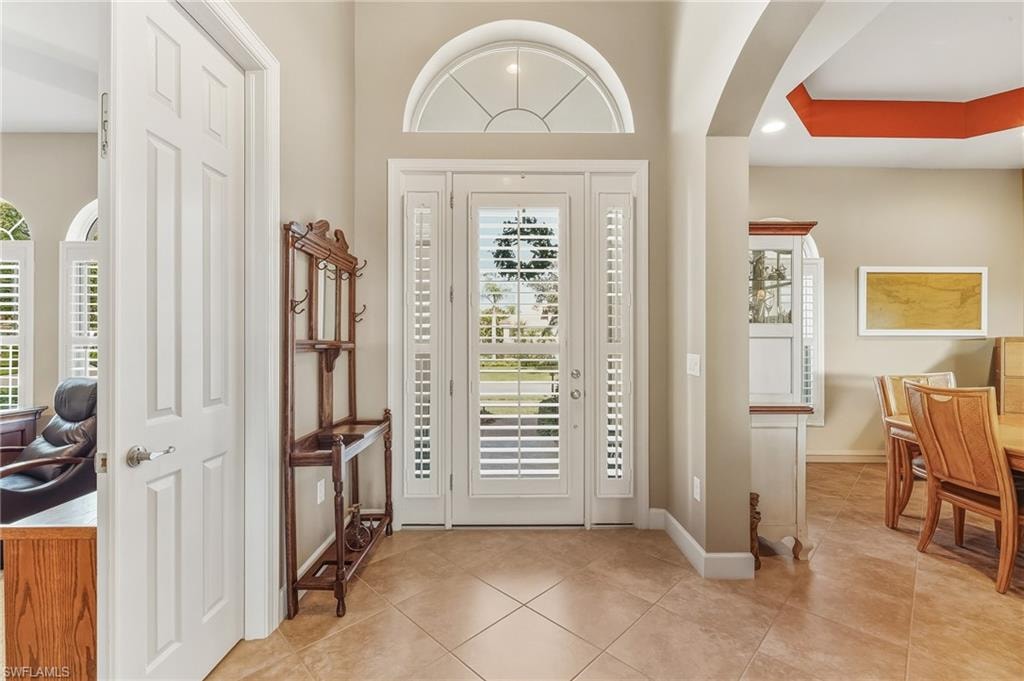 Front door with glass inserts & transom window allows for more natural light.