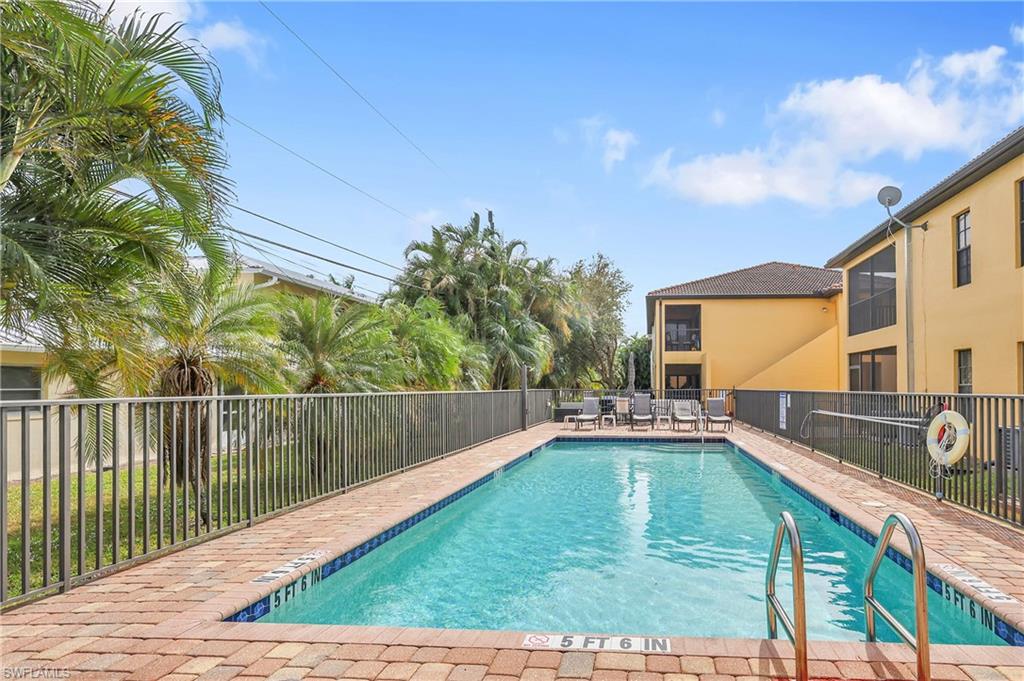 Community pool with a patio area
