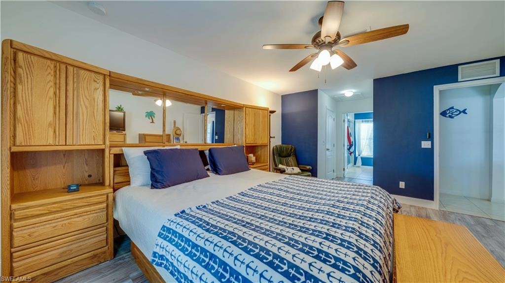 Bedroom featuring light wood-style floors and a ceiling fan