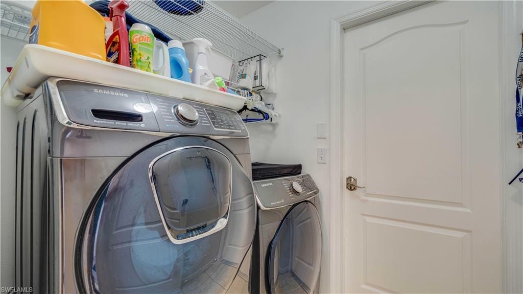 Laundry room featuring washing machine and clothes dryer