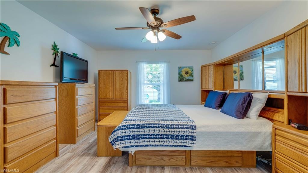 Bedroom featuring light wood-style floors and ceiling fan