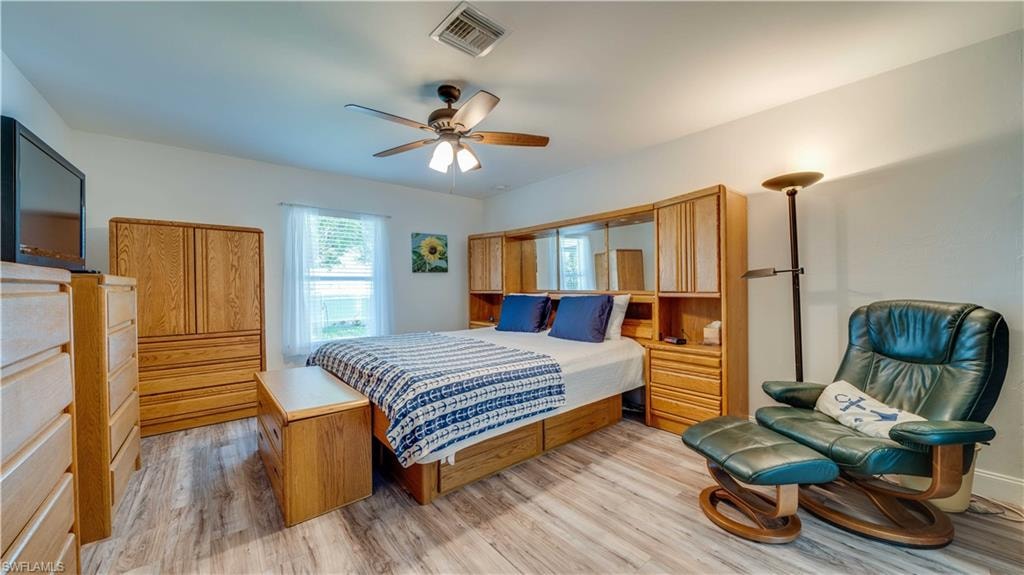 Bedroom with light wood-type flooring and ceiling fan