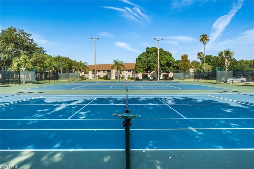 View of tennis court featuring community basketball court