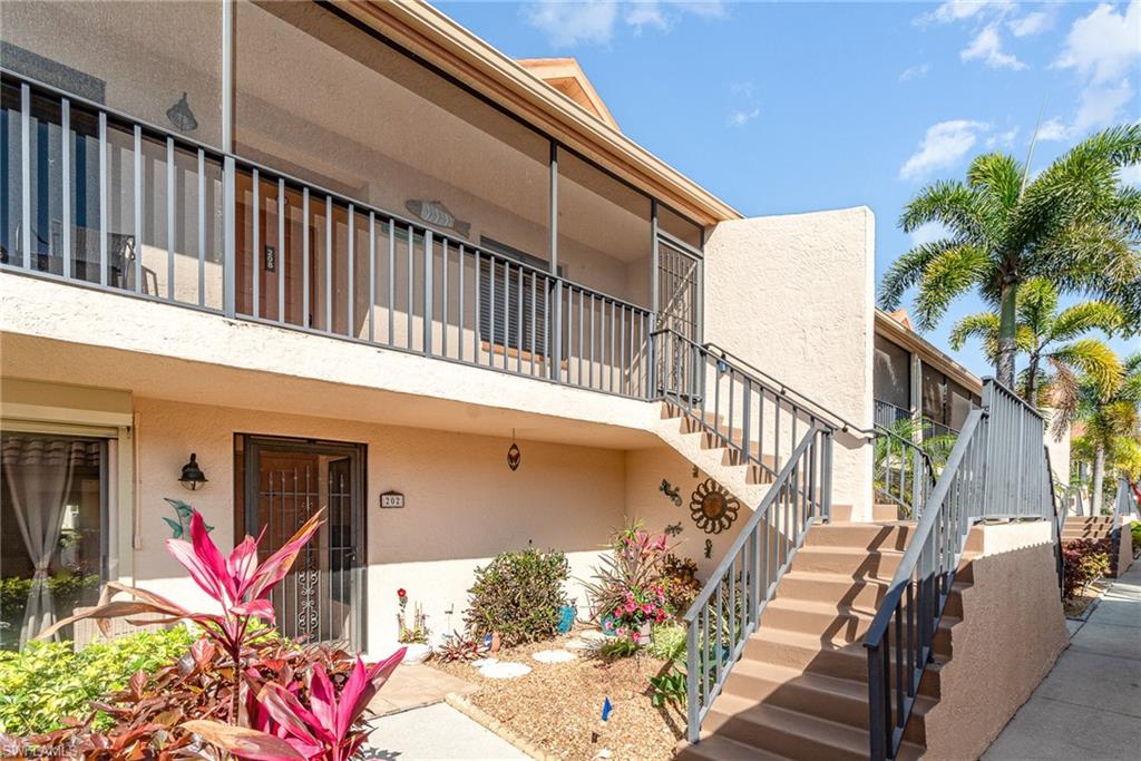 Doorway to property with stucco siding