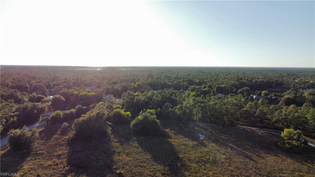 Aerial view of property's location with a forest