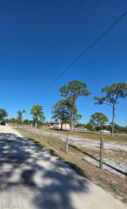 View of asphalt road with a view of countryside
