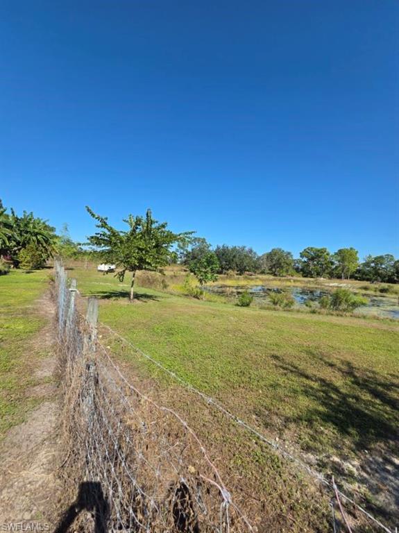 View of grassy yard featuring a water view