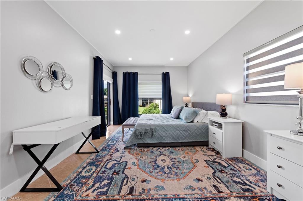 Bedroom with recessed lighting and light tile patterned flooring