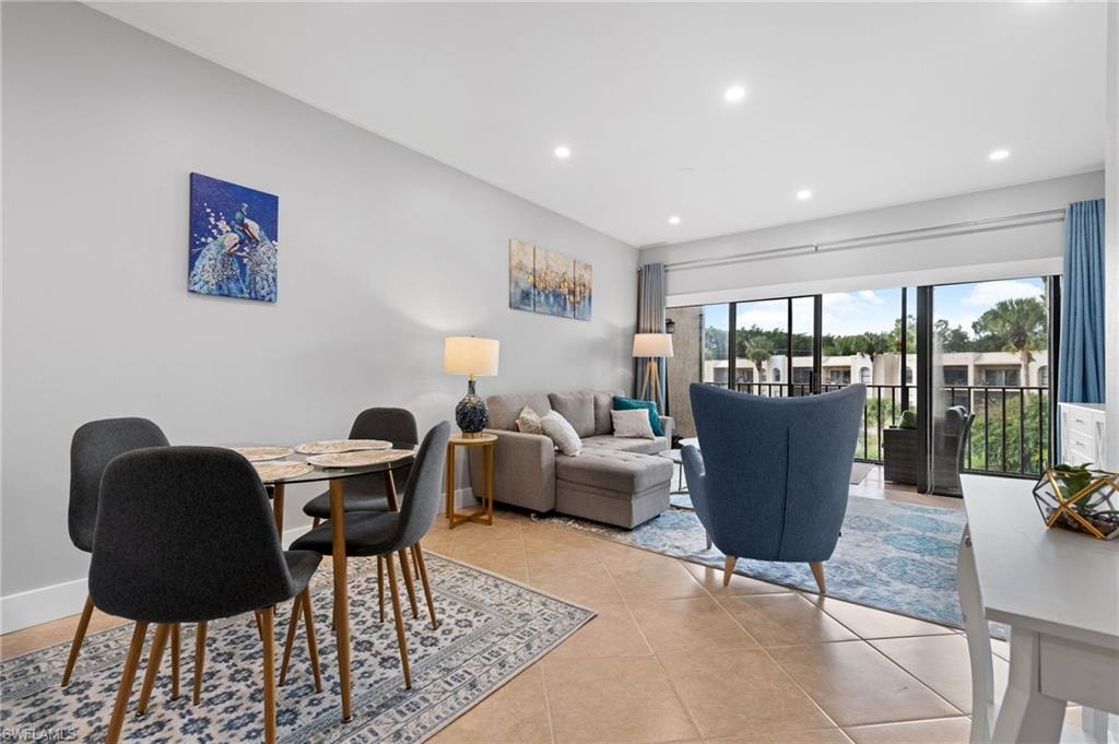 Dining space featuring recessed lighting and light tile patterned floors