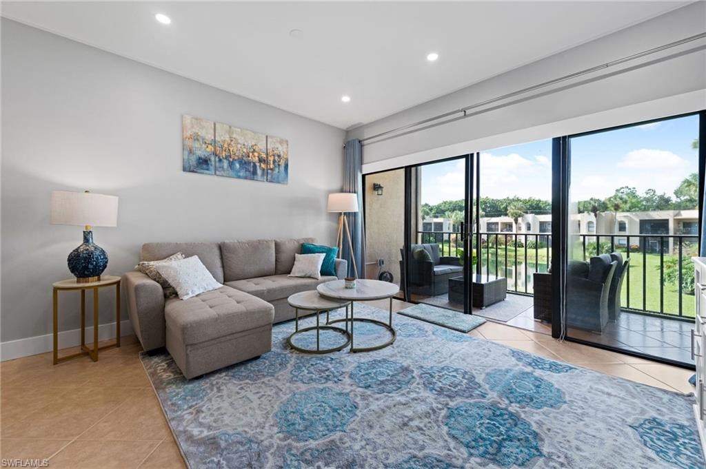 Living room featuring light tile patterned floors and recessed lighting