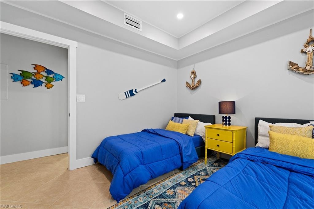 Bedroom featuring tile patterned flooring and recessed lighting