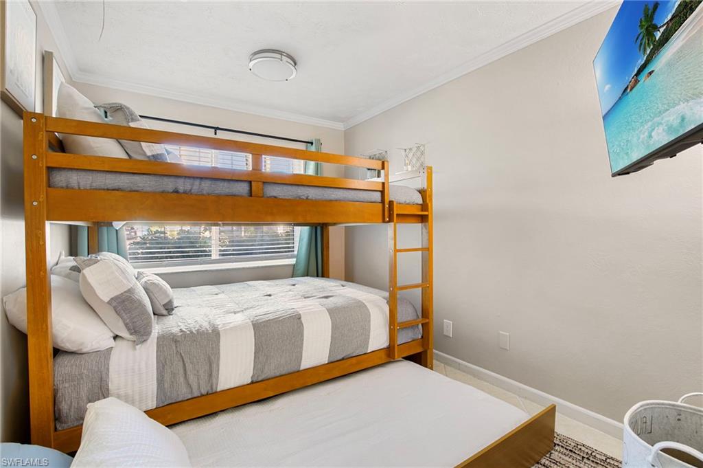 Bedroom featuring baseboards and ornamental molding