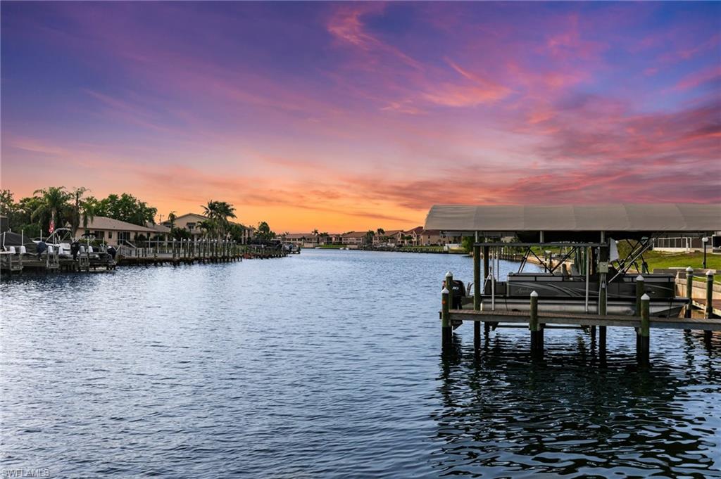 Dock area featuring a water view and boat lift