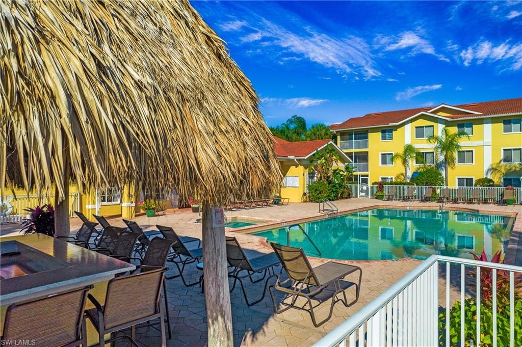 Community pool with a patio