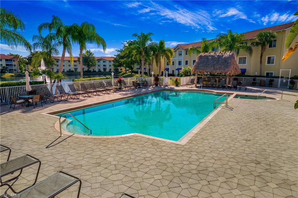 Community pool with a patio